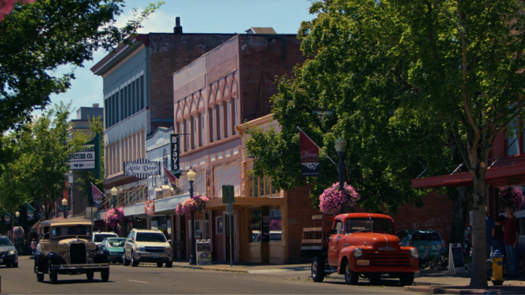 Vintage cars drive down Tower Avenue in Centralia, Washington.
